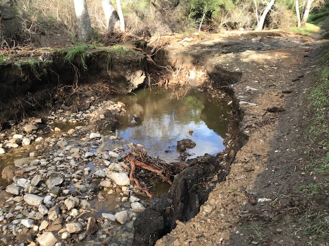 COMBATING DAMAGE: Historic January storms caused significant damage to Colson Canyon Road, and residents are still waiting for the road to be fixed nearly six months later.