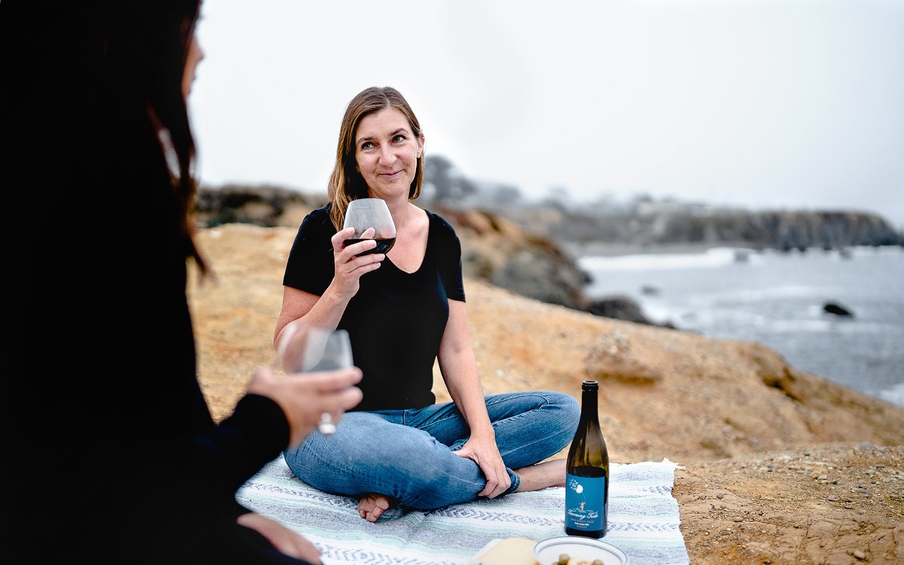 Local winemaker Alisa Jacobson celebrates the bottling of two new Turning Tide wines