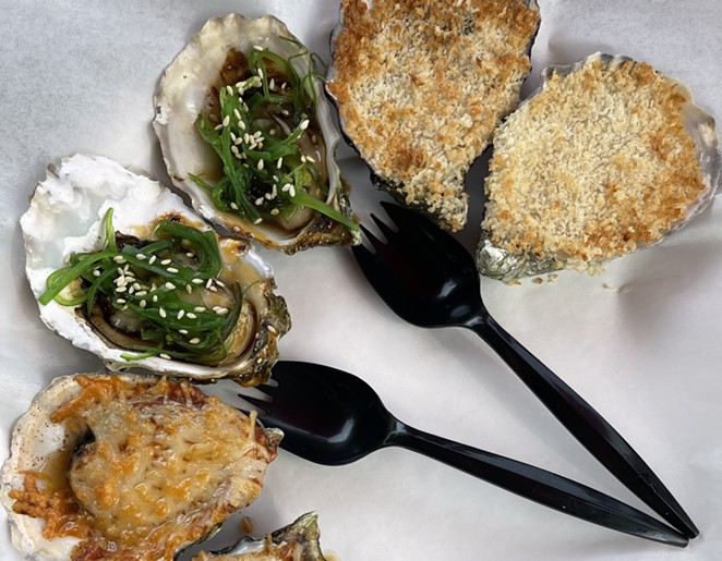 ON FIRE: Tuck into broiled oysters at Mother Shuckers that come with toppings (from left to right) like a Cajun blend, poke sauce and seaweed salad, and lemon garlic butter with panko crumbs.