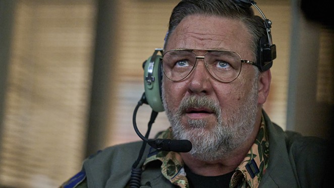 REAP THE WHIRLWIND: U.S. Air Force drone pilot Capt. Eddie Grimm “Reaper” (Russell Crowe) works to protect a Delta Force team under attack, in Land of Bad, screening on Netflix.