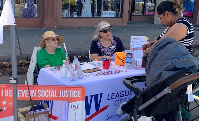 REGISTERING VOTERS: North Santa Barbara County League of Women Voters Secretary Sandy Boyd (left) and voter service committee member joyce ellen lippman (who doesn’t capitalize her name) help register residents to vote during a tabling event in North County.