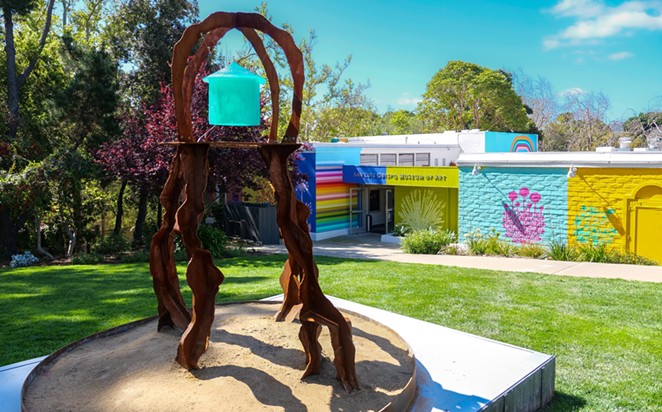 TIDE WALKERS: Before entering the San Luis Obispo Museum of Art, the Outlandish exhibit begins on the lawn with Tidewalker showing four figures holding a basket of water above their heads.