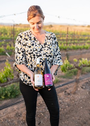 Local winemaker Alisa Jacobson celebrates the bottling of two new Turning Tide wines